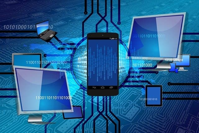 Photo of Laptop, Phone, and other Gadgets, with Artificial Intelligence