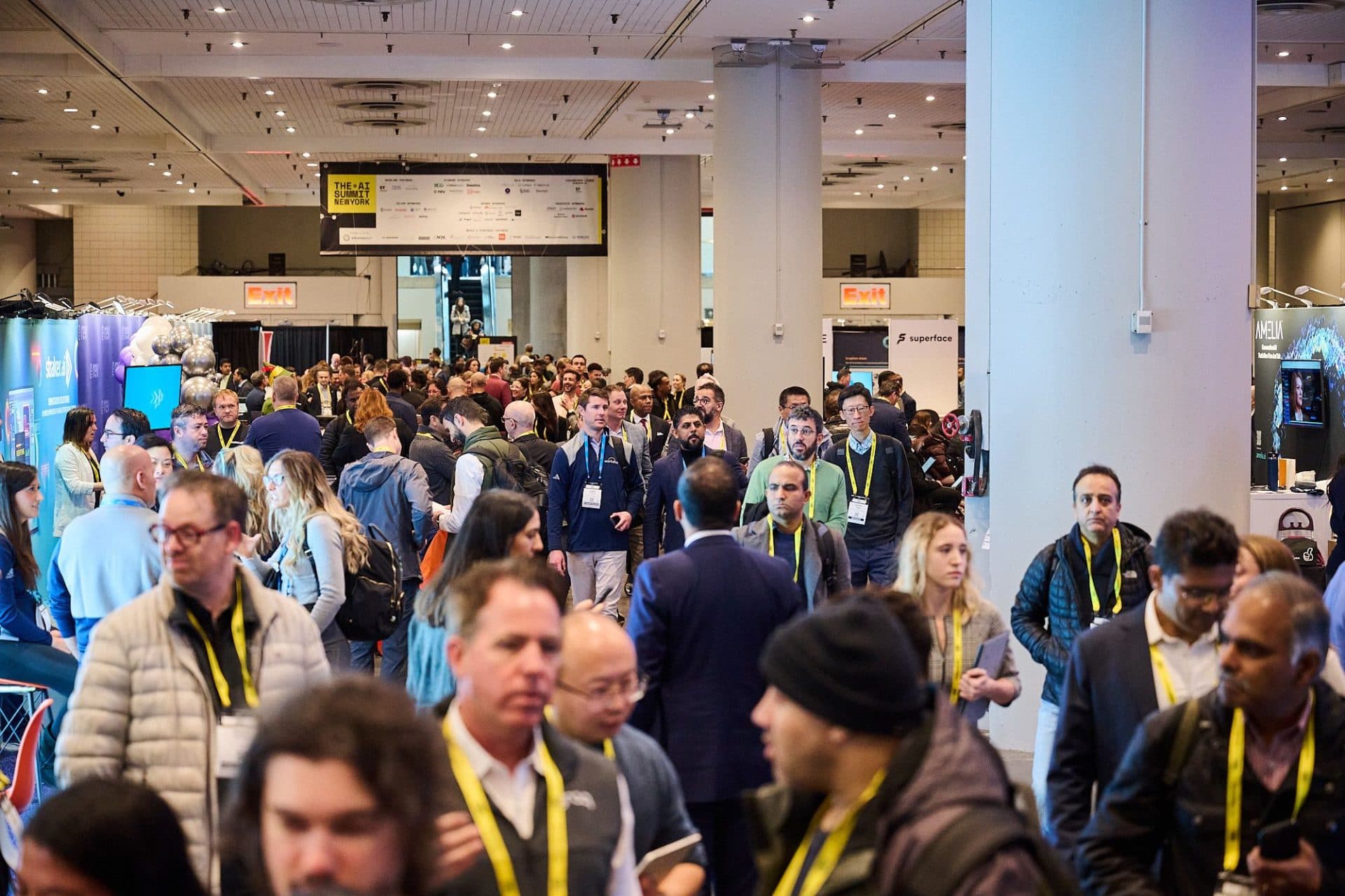 Stage at The AI Summit New York, featuring a large screen and branded backdrop. AI event series.