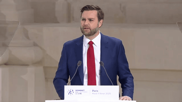 Panel discussion at the Paris AI Summit, featuring multiple speakers on a stage with a blue backdrop.